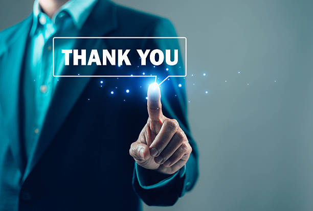 Business professional pressing thank you message on digital interface, representing customer appreciation, gratitude, client relationship, positive feedback, and service satisfaction concept.